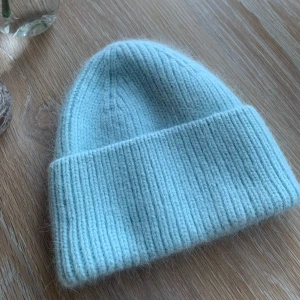 FWSS mössa beanie - Ljusblå oanvänd mössa i alpacka ull. Varm och skön. 