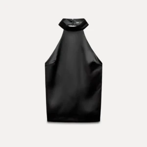 Svart topp med rosett - En svart topp med öppen rygg , helt ny inte ens provad. Storlek M från ZARA.