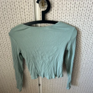 Topp med öppen rygg - Topp med öppen rygg