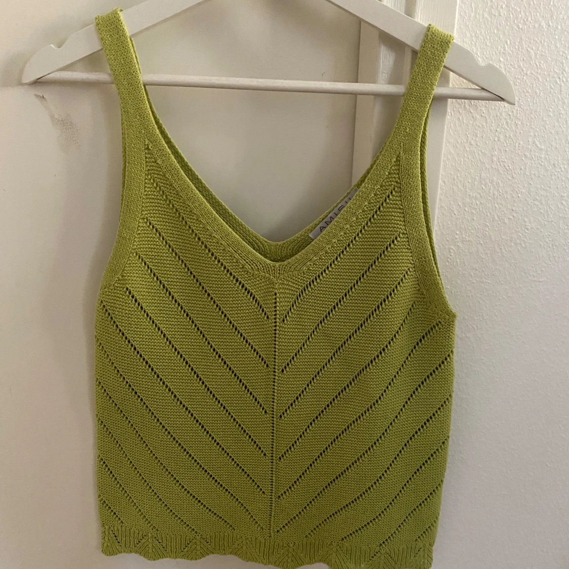 Grön stickad linnetopp