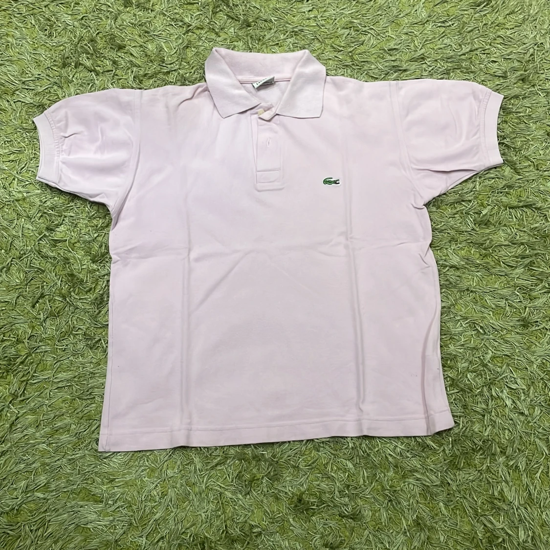 Ljusrosa pikétröja från Lacoste