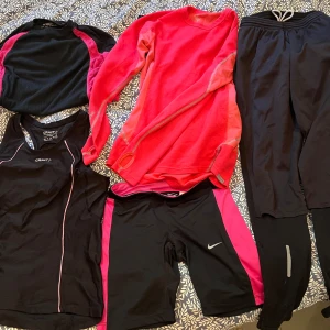 Svart/rosa träningsoutfit - Matchande träningskläder för gymmet och utomhus när det är lite kyligare. korta tights - Nike S träningslinne - Craft S superunderställströja - Mc Kinley 36/38 lite tjockare under/träningströja (rosa) - Houdini S vintertights lårvindskydd - Newline S