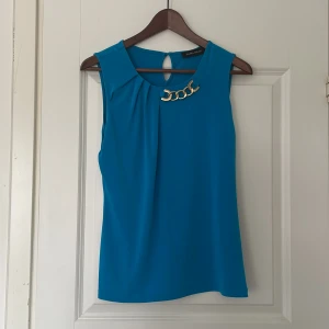 Turkos topp - Snygg topp inköpt i New York 2013. 