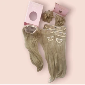 Hair Extension Bundle - Synthetic hair  Imcludes:  All clip ins  Ponytail  2 buns  Light golden blonde 