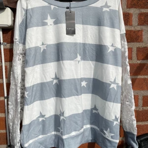 Snygg ny tröja. Strl L men väldigt stor - Snygg tröja.  Ny.   Strl L men passar upp till 48/50.