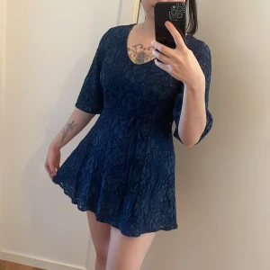 Mini blue dress - Originally from Singapore- size is M (can fit S here). Strings at the side can be tied in front or behind. Zip behind the dress for easy wearing 