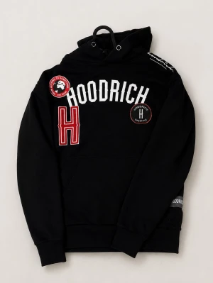 Svart hoodie från Hoodrich XS Men funkar som S - Säljer en svart hoodie från Hoodrich i storlek XS men funkar bra som S också. Hoodien har flera broderade patches och tryck i vitt och rött, stor ficka framtill och klassisk huva med dragsko. Perfekt för dig som gillar streetwear och vill sticka ut med coola detaljer.