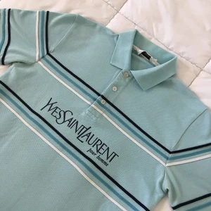 “ YSL Baby Blue Polo “ - • Used, but in good condition. Only some bobbling on tee, nothing else.  • Size ( S )