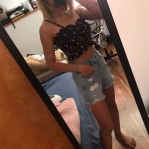 Cropped black pink top  - Black with pink and white small flowers, runs short but fit both a S and M!