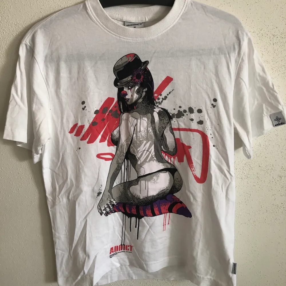 Addict Streetwear Clothing Classic Girl Clown T-Shirt  Size small, men’s small / extra small fit.  Excellent condition, no flaws or damage.  DM if you need exact size measurements.   Buyer pays for all shipping costs. All items sent with tracking number.   No swaps, no trades, no offers. . T-shirts.