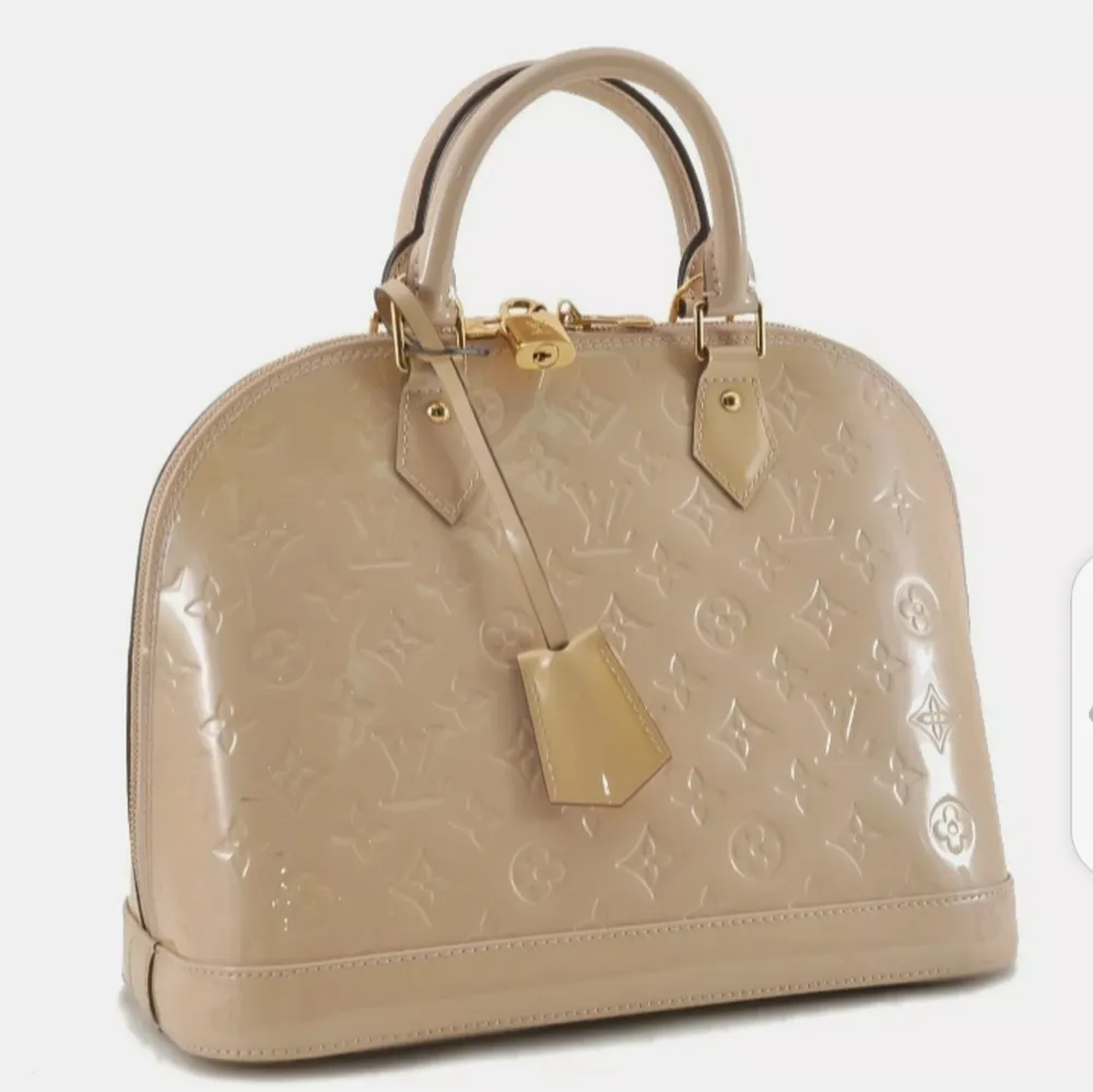 Authentic Louis Vuitton Vernis Alma PM Hand Bag Beige M90170 LVBrandLouis VuittonMade inFranceSerial Number / Date CodeFL5103MaterialPatent LeatherColorBeigeStyleHand BagSize(cm)W31.5 x H24 x D15cm / Handle Drop 9cm(Approx)Size(inch)W12.4 x H9.4 x D5.9