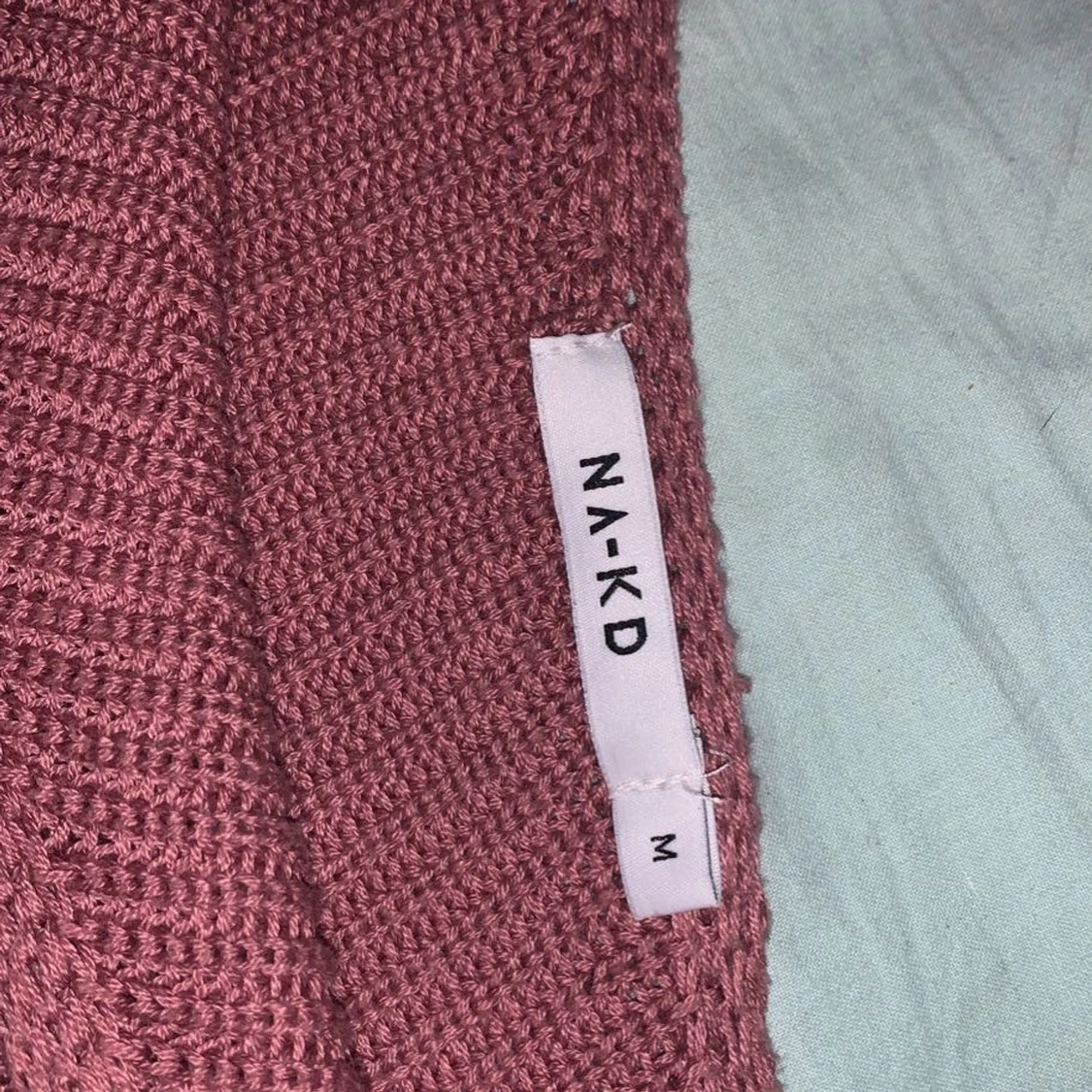 Enarmad rosa stickad tröja