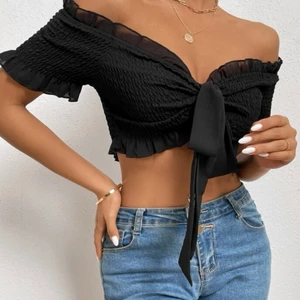 Oanvänd topp - Oanvänd topp, bandet är avtagbart. Storlek S.