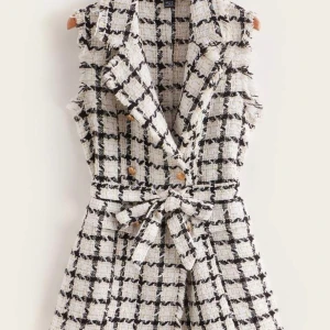 Svart/vit väst  - En jätte fin svart/fin väst, armlös. 