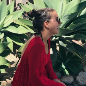 Short red beach dress  - One of my go to beach dresses that I’ve now grown out of (too short).   Flared red dress/long too with long-sleeves and open back. 