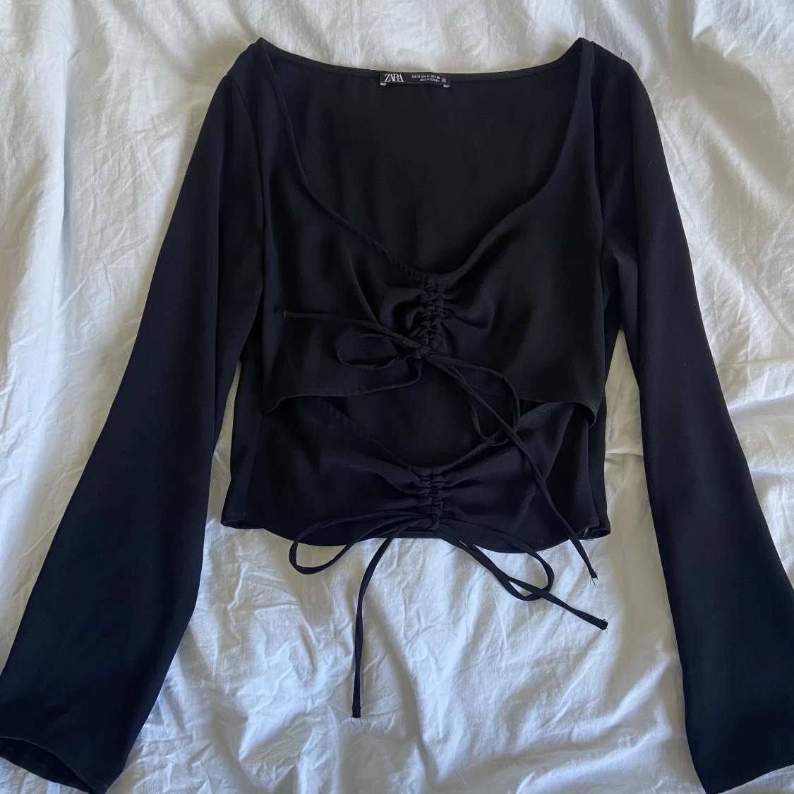 Långärmad tröja med öppen mage