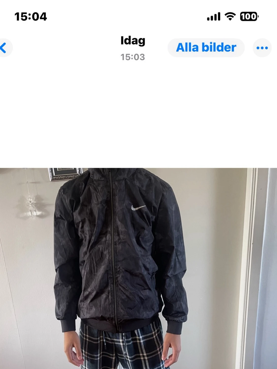 Svart Nike vindjacka med camomönster