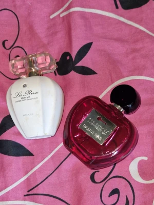 2 styck parfymer  - 2 parfymer i ok skick. Halva eller lite mer än så. La rive är 75 ml och her secret temptation banderas är 80 ml. 