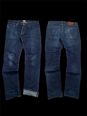 Japanese selvedge denim - NOT A.P.C. Japanese light selvedge denim from Livid Jeans. Dark blue high quality jeans with cool washes and phone fade. Jeans are in flawless condition and have the perfect fit. Measurments: waist 44cm, full length 101cm. 