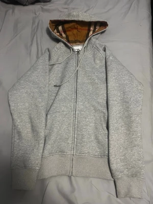 Grey Burberry hoodie size S - Its in very good condition!!                            I sell it because its too small for me.