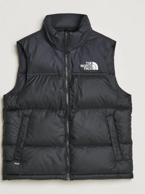 Svart dunväst från The North Face - Snygg svart dunväst från The North Face i storleken medium. Den är skrynklig på bilden då den legat ihoptryckt, vilket kommer försvinna av sig självt. Västen har logga på bröstet och ryggen samt 700-brodyr vid nederkanten. 