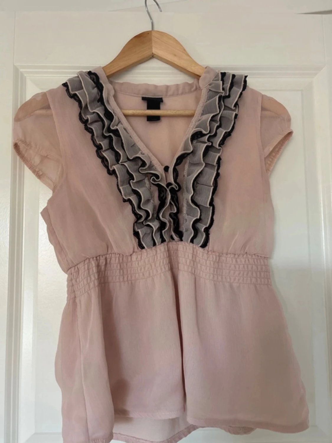 Ljusrosa blus med volang från H&M
