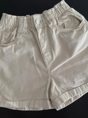 Beige shorts  - Beige shorts   Size: XS Condition: used, in good condition  Details: lightweight fabric, elastic waistband, comfortable fit, perfect for everyday wear and summer outfits  💰 Price: 150 kr  📦 Fast shipping / meet-up possible Message me if interested 💌