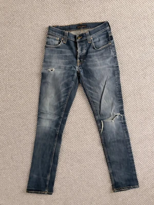 Nudie jeans - Nudie jeans i storlek w30 l32. Modell: grim Tim.