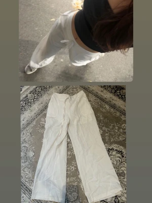Vita vida linnebyxor - Säljer ett par vita linnebyxor med avslappnad passform och dragsko i midjan. Byxorna har raka, vida ben och är perfekta för en chill och stilren look. Materialet är tunt och luftigt linne, vilket gör dem sköna att bära varma dagar.