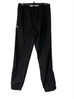 Lacoste byxor  - Snygga Water-Repellent Sport Sweatpants från lacoste i mycket gott skick