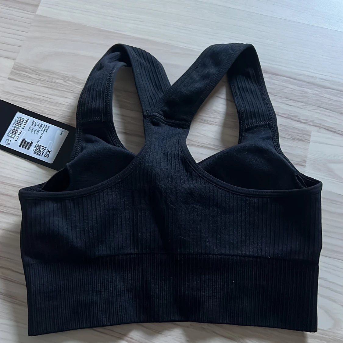 Svart ribbad sporttopp från TriDri. - 1