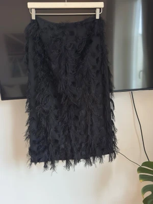 Black skirt from H&M in S size  - Never used skirt from H&M in S Size in black color. It has textured fabric and zip at the back. Waist: 14.5 inch (measured from front only)  Total length: 32inch   Please check my other listing to get bundle offer.