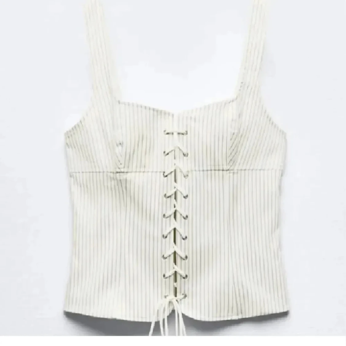 Randig vit korsett med snörning