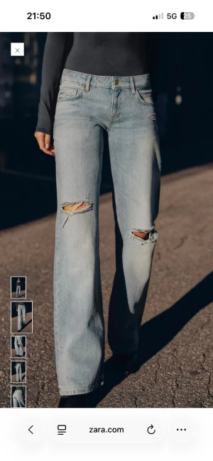 Ljusa wide jeans med slitningar från Zara - Trendiga zara jeansen. Använda två tre gånger. 