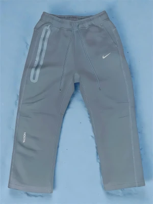 Nike Nocta LightBlue Pants - Det Selling a pair of light blue NOCTA pants because they’re too small for me. They’re in perfect condition and have had only one previous owner. Clean and well-kept with no flaws. These pants are perfect for a casual look while still being a branded, stylish piece. Please make sure to contact me before purchasing, as the sizing runs a bit small.