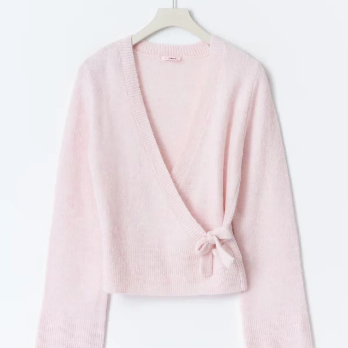 Ljusrosa omlottkofta från Gina Tricot