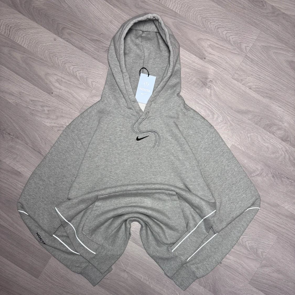 Grå NOCTA x Nike hoodie 