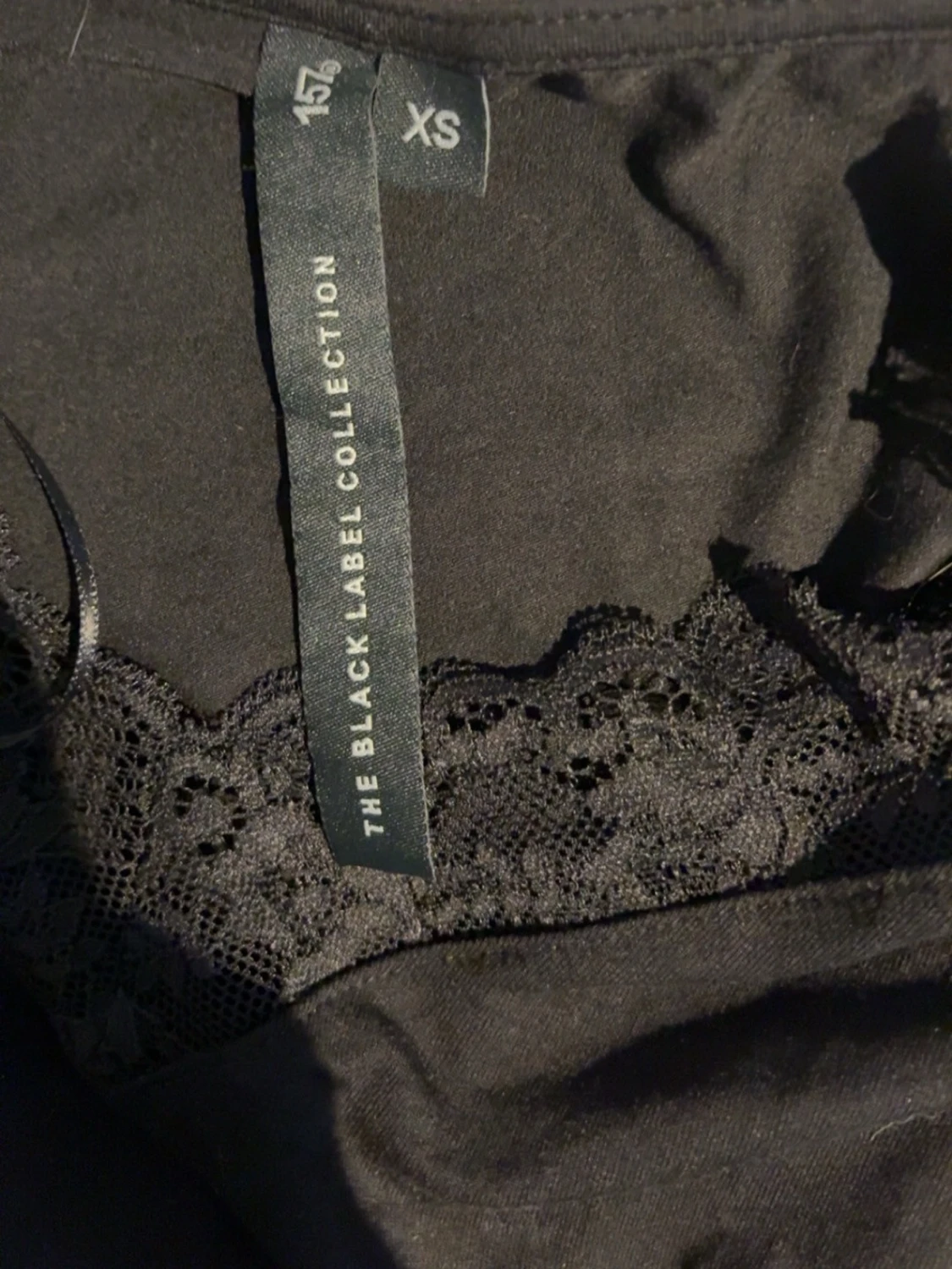 Svart spetsdetaljerad topp XS - 1