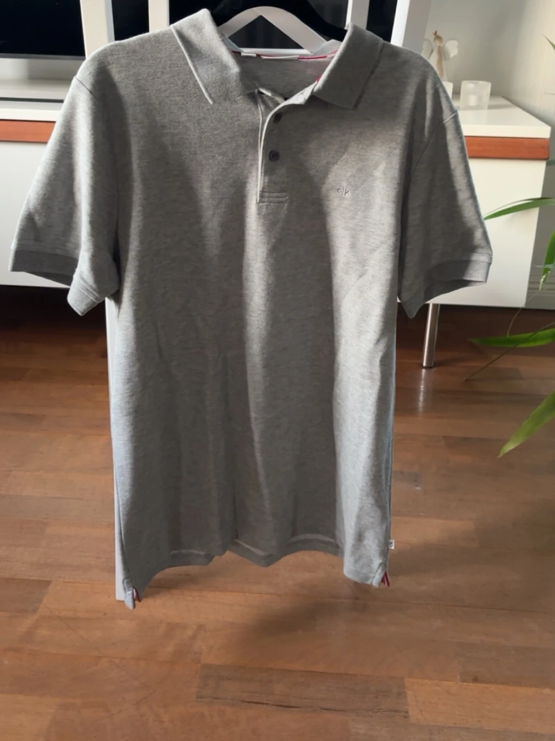 Grå pikétröja i bomull