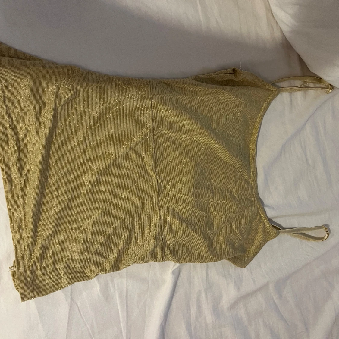 Glittrig guldig linnetopp