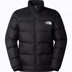 Svart dunjacka från The North Face - Säljer en svart dunjacka från The North Face med hög krage och dragkedja framtill. Jackan har en klassisk pufferstil med logga på bröstet och är perfekt för kalla dagar. Stilren och enkel design som passar till det mesta.