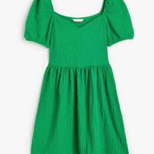 Struktur mönstrad trikåklänning med puffärm - Helt ny med prislapp 