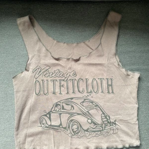 Brunt linne med tryck - Endast testad så knappt använd!