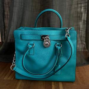 rare teal coloured bag  Comes with dust bag Pristine condition - never used 