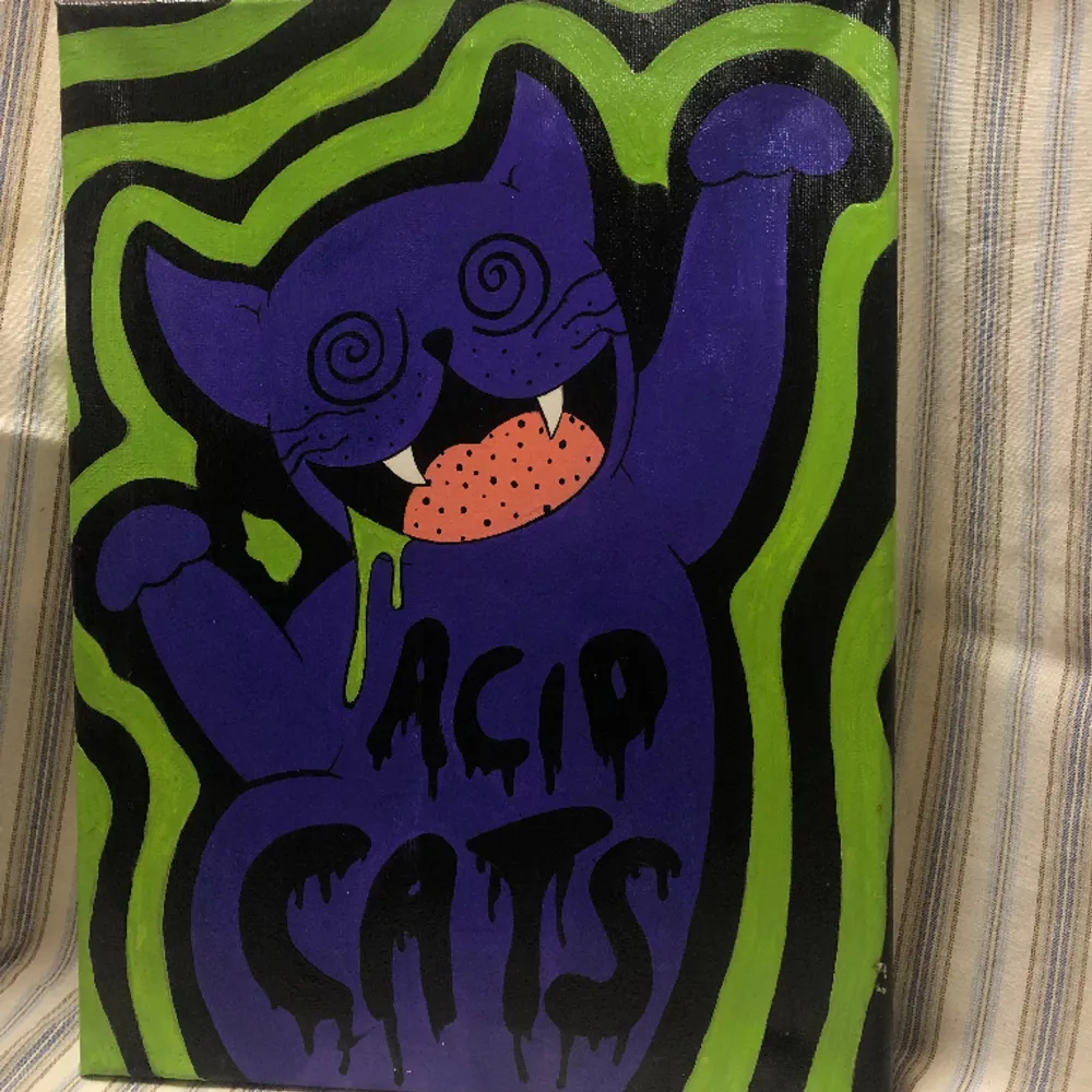 Handmålad tavla med motivet ”acid cat” . Övrigt.