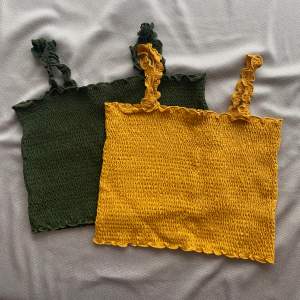 Dark green and yellow coloured bandeau like tops. Stretchy material.