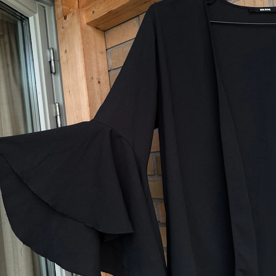 Luftig väst/blus med utsvängda ärmar - 90