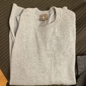 Hm tröja - Ljusblå hm tröja