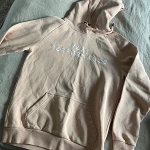 Rosa/beige peak performance hoodie - Rosa/beige peak performance huv tröja 