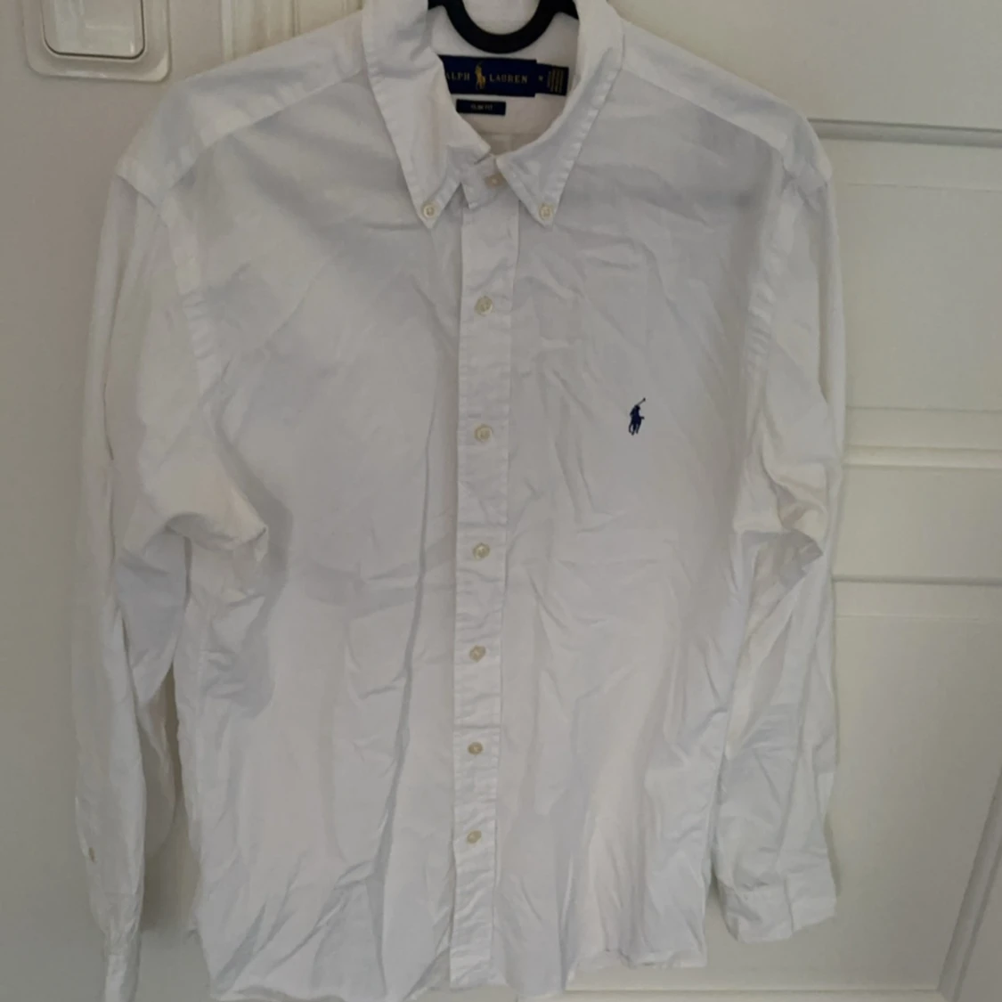 Ralph Lauren skjorta, tar emot bud